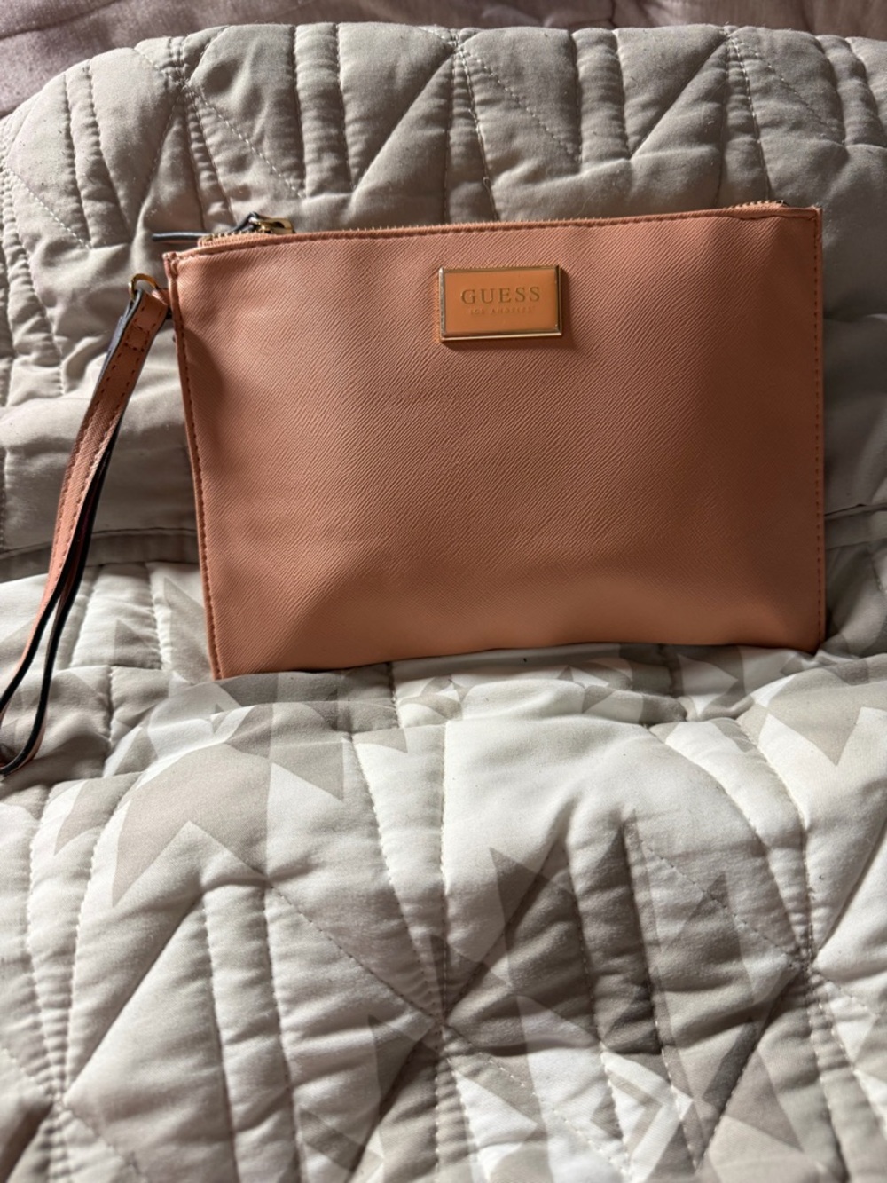 GUESS Peach-Pink Wristlet Clutch with Gold Logo Plate